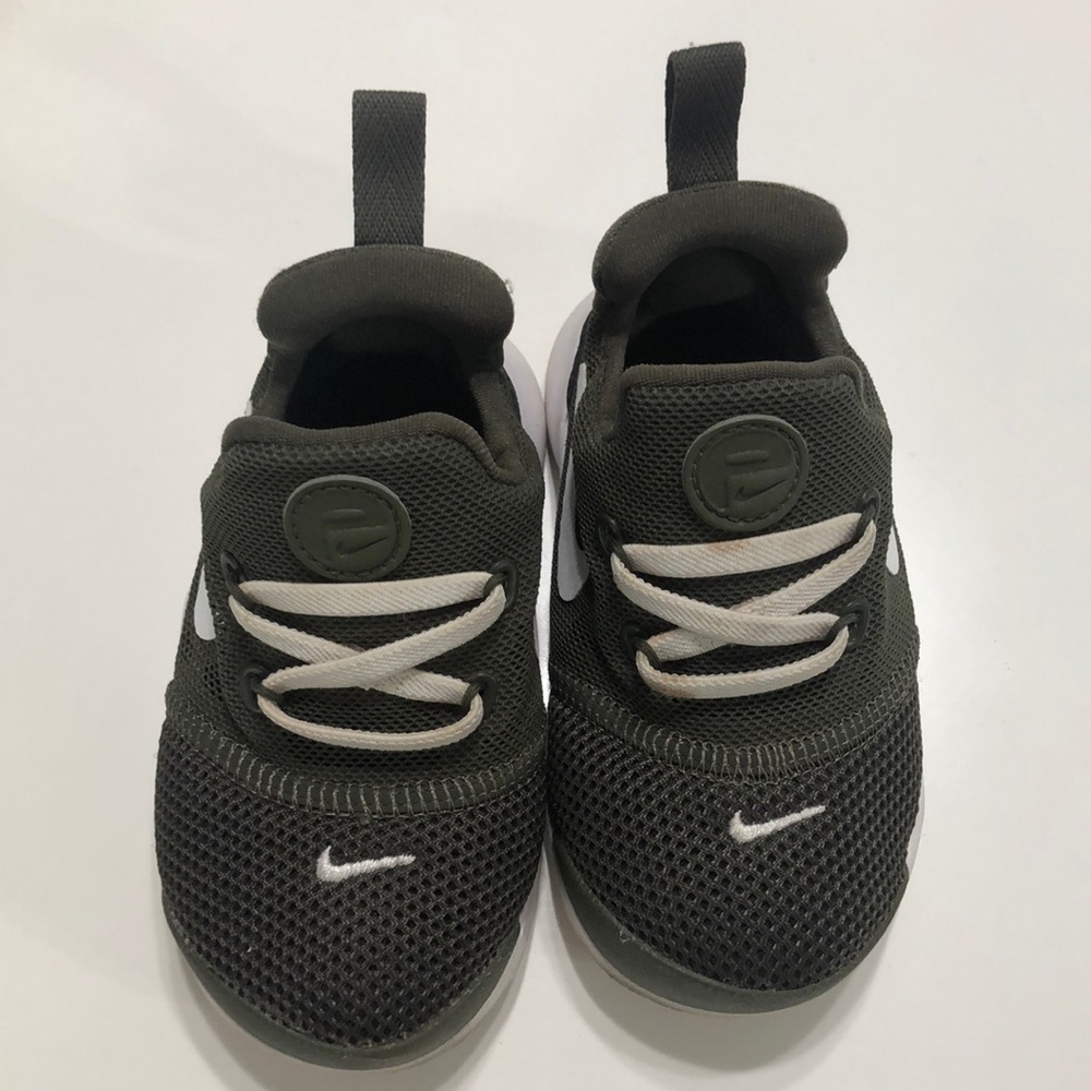 Like new olive green Nike sneakers.